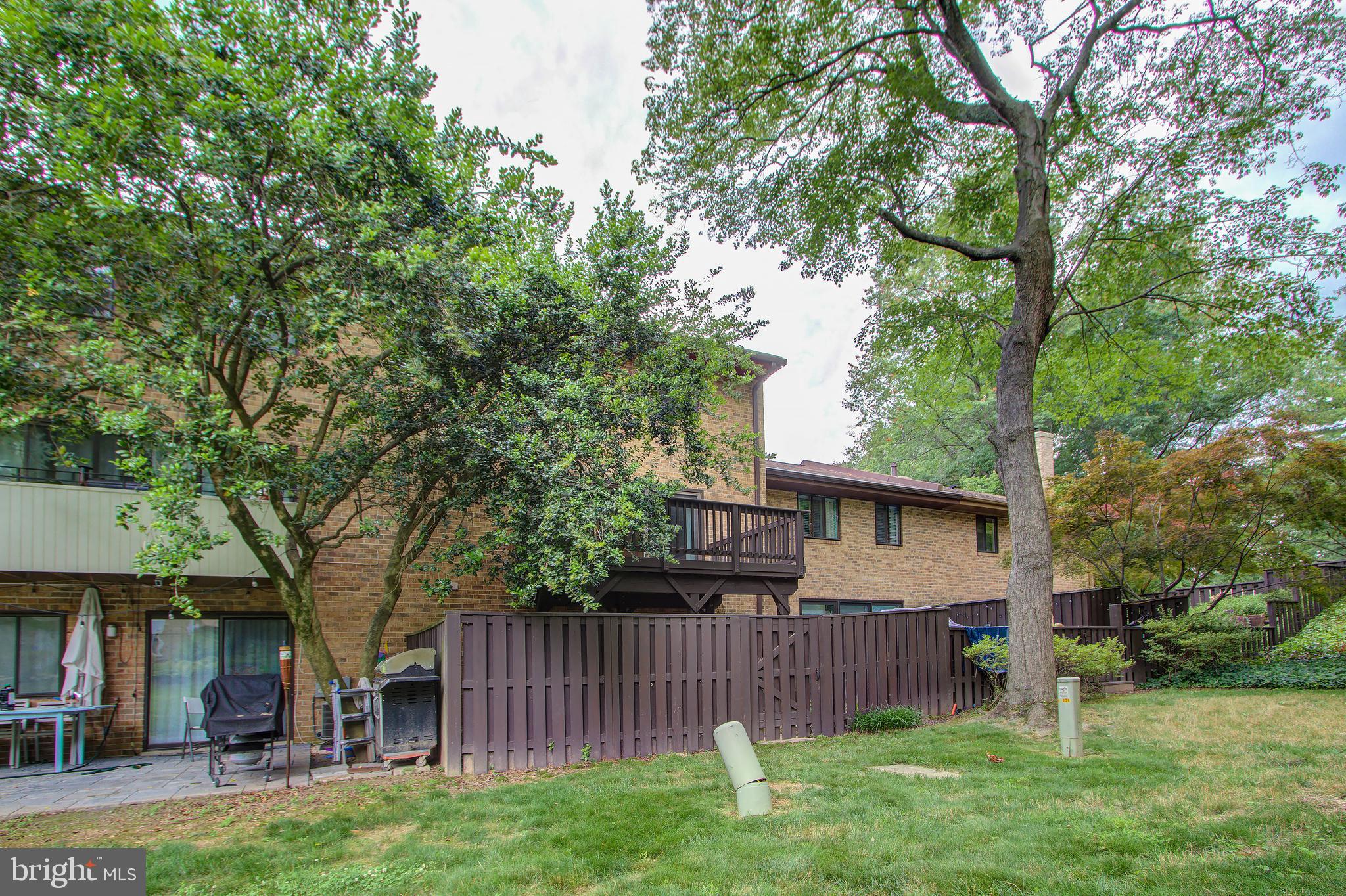 11024 Saffold Way Reston, VA 20190 - Photo 41 of 50 a view of a yard with a house and a large tree