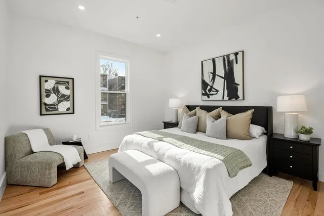 a bedroom with bed and window