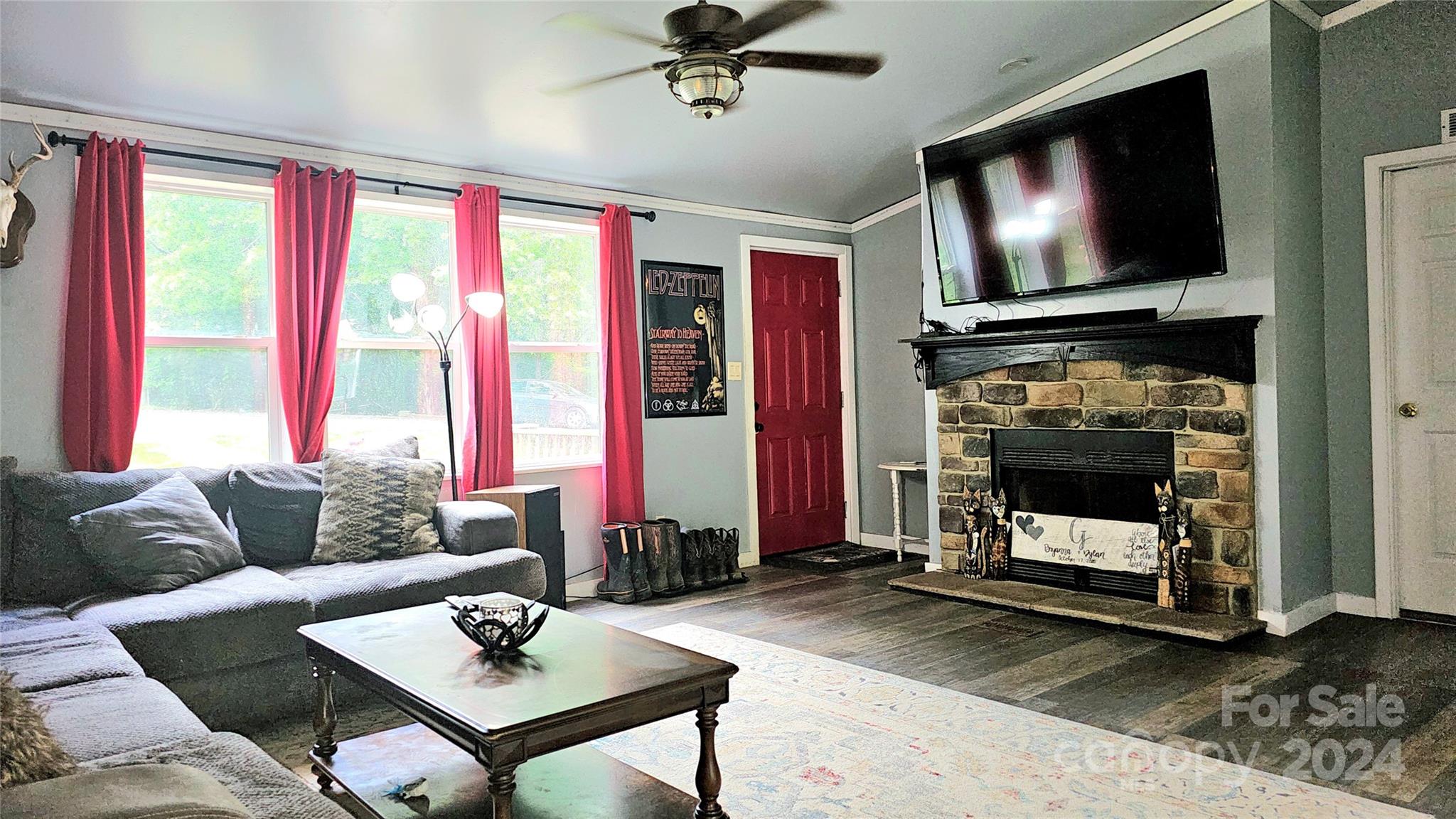 5015 Medlin Road Monroe, NC 28112 - Photo 5 of 19 a living room with furniture and a flat screen tv