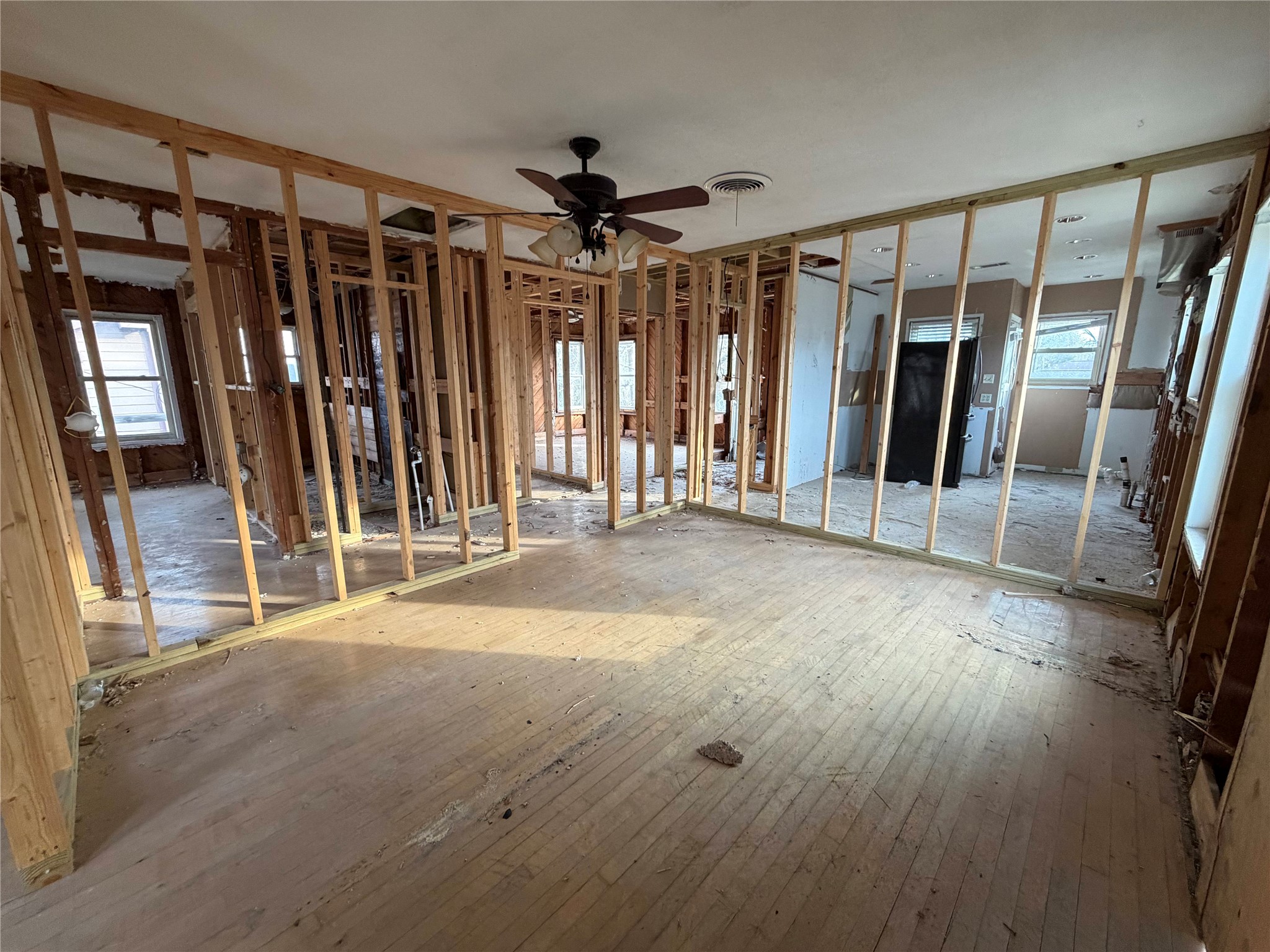 611 Mathis Street Houston, TX 77009 - Photo 17 of 22 a view of an empty room with wooden floor and stairs
