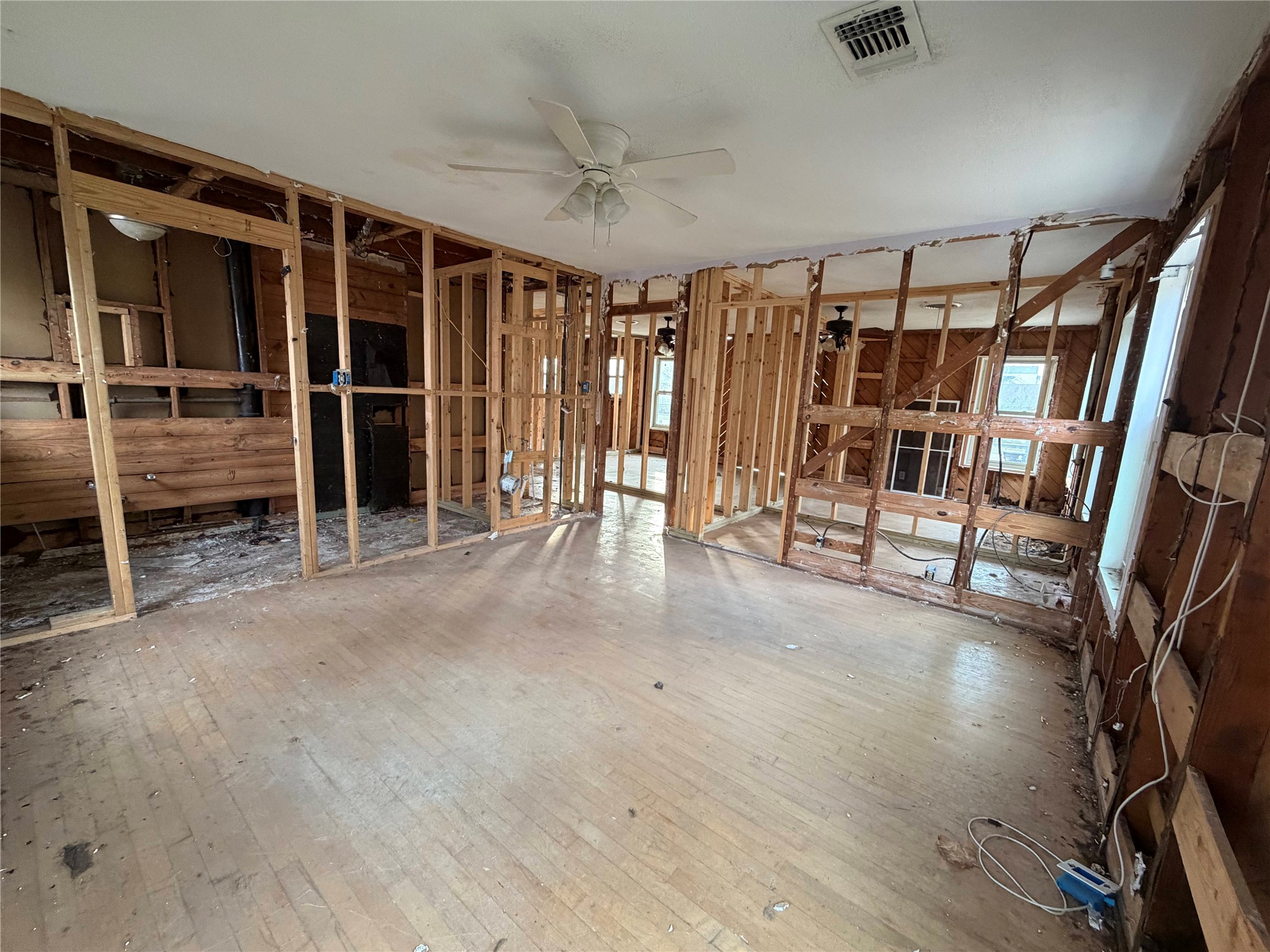 611 Mathis Street Houston, TX 77009 - Photo 21 of 22 a view of an empty room with wooden floor and a window