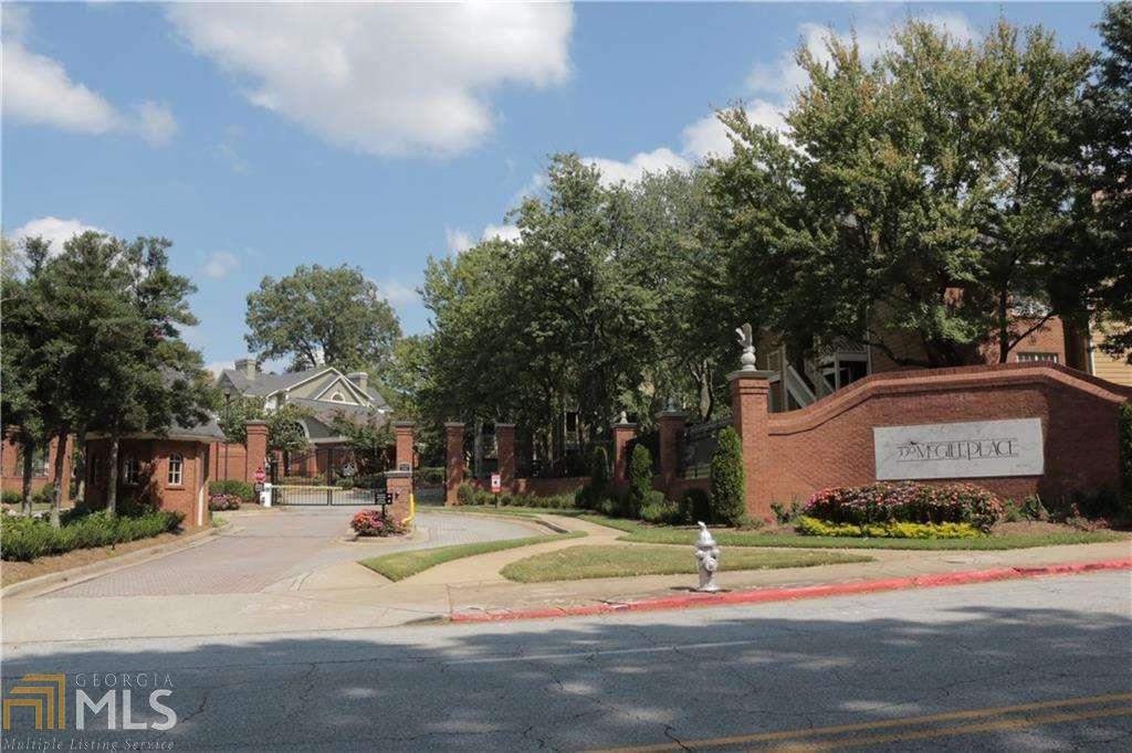448 McGill Place Northeast Atlanta, GA 30312 - Photo 1 of 1 a sign board with buildings in the background