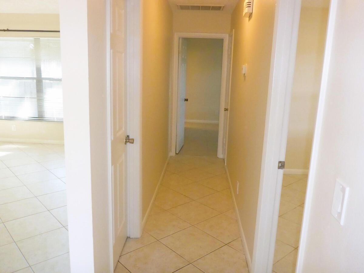 431 Jupiter Lakes Boulevard, Unit 2109A Jupiter, FL 33458 - Photo 12 of 23 a bathroom with a shower