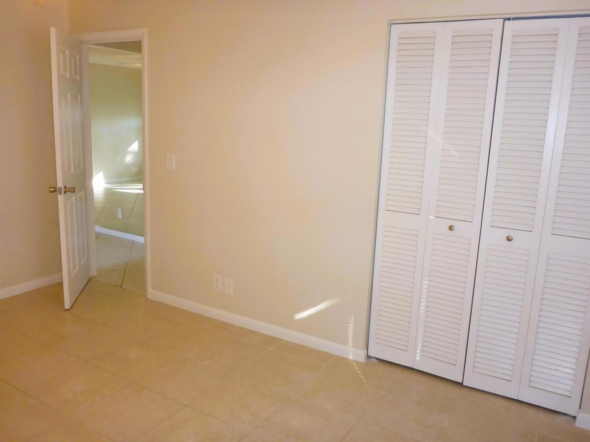 431 Jupiter Lakes Boulevard, Unit 2109A Jupiter, FL 33458 - Photo 16 of 23 an empty room with windows