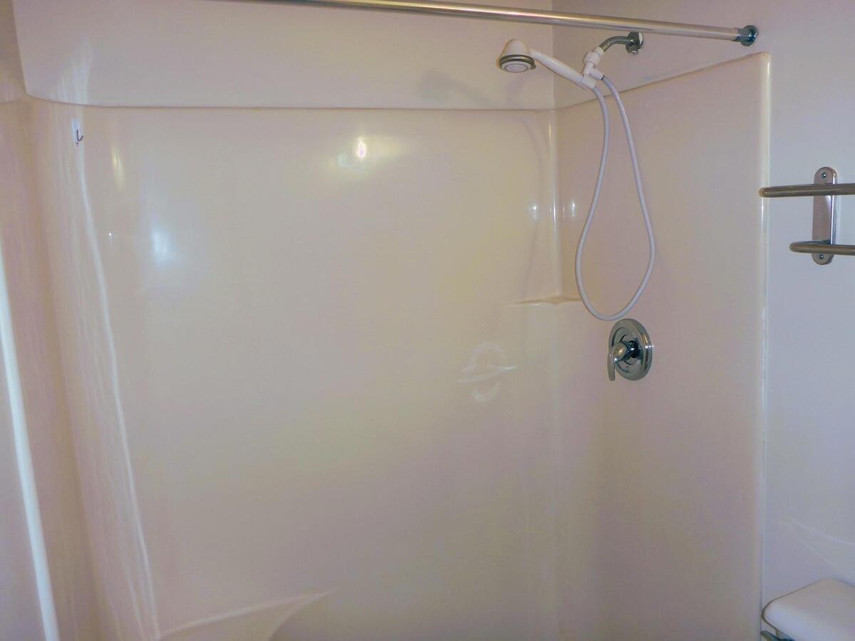 431 Jupiter Lakes Boulevard, Unit 2109A Jupiter, FL 33458 - Photo 20 of 23 a bathroom with a shower