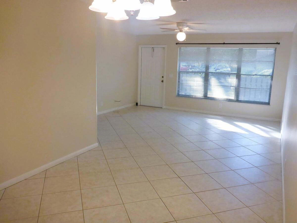 431 Jupiter Lakes Boulevard, Unit 2109A Jupiter, FL 33458 - Photo 7 of 23 an empty room with windows and closet