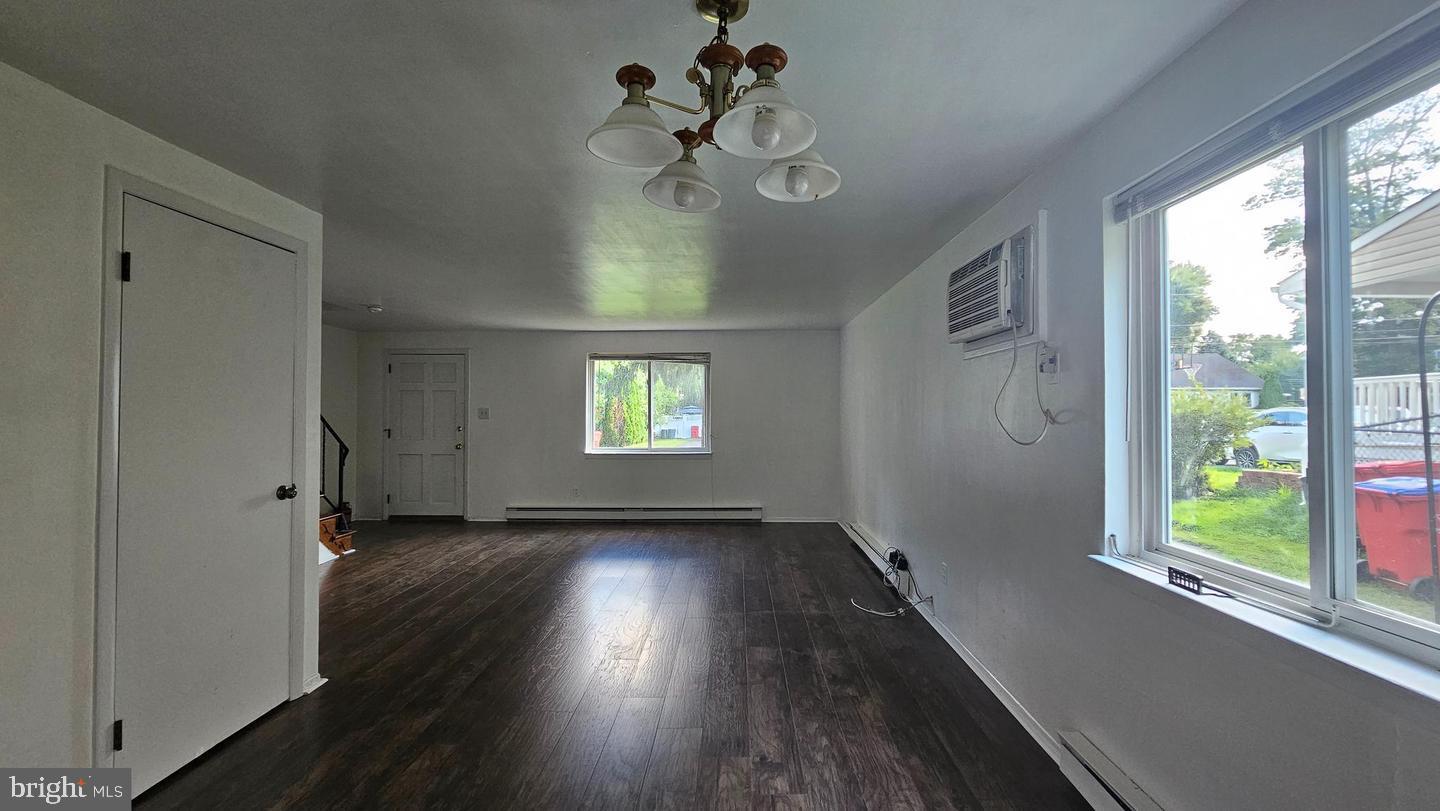 485 4th Avenue Warminster, PA 18974 - Photo 11 of 29 a view of an empty room with wooden floor and a window