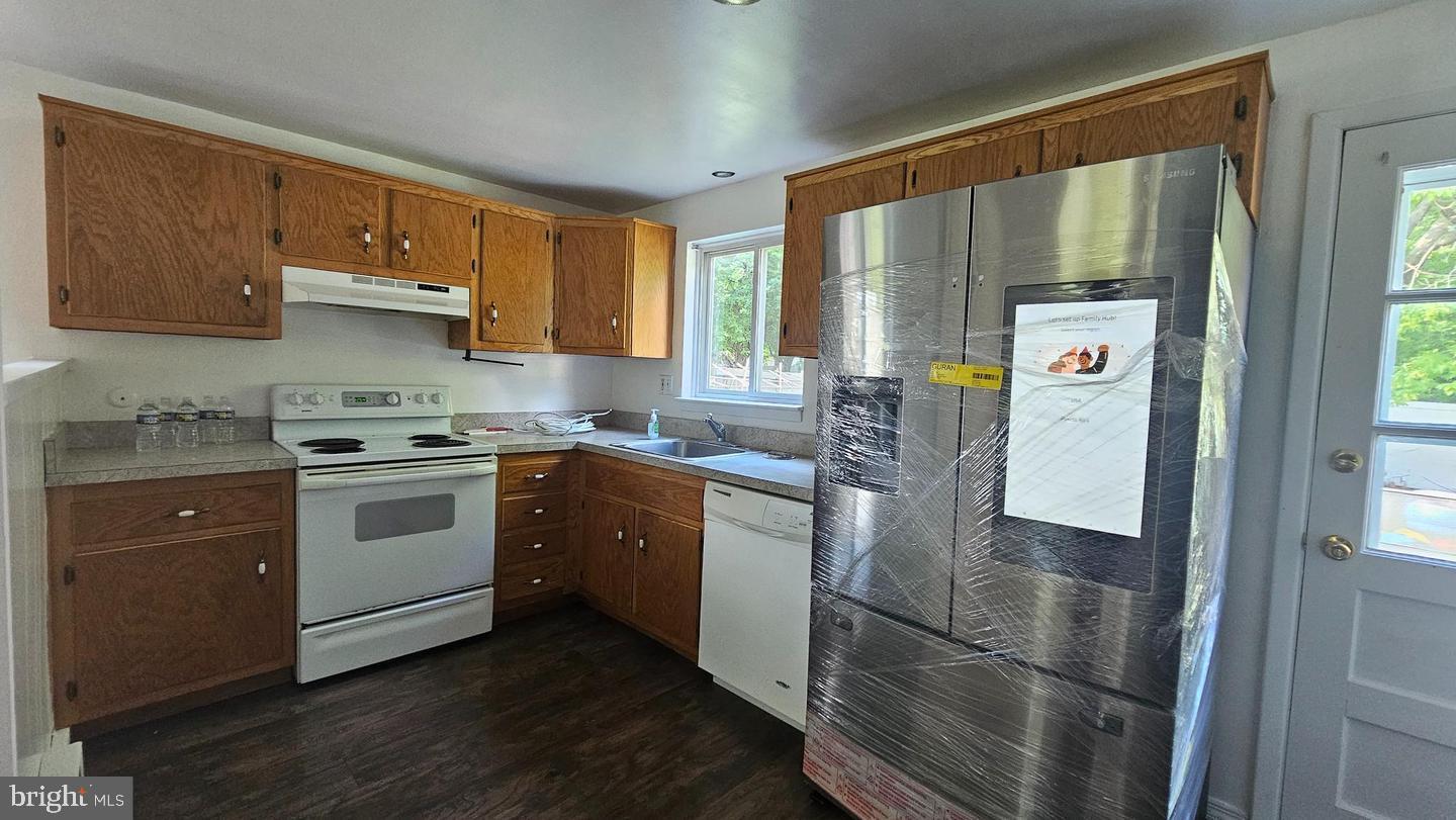 485 4th Avenue Warminster, PA 18974 - Photo 14 of 29 a kitchen with stainless steel appliances a refrigerator sink and cabinets