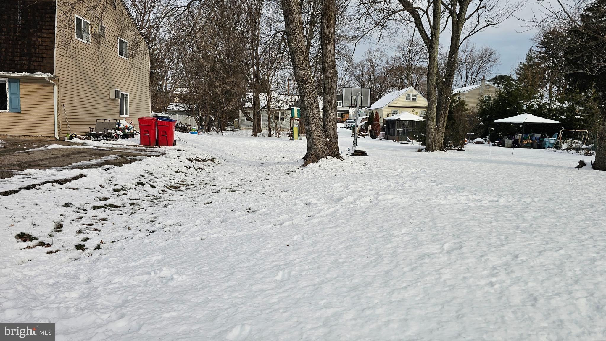 485 4th Avenue Warminster, PA 18974 - Photo 2 of 29 a street view with large trees