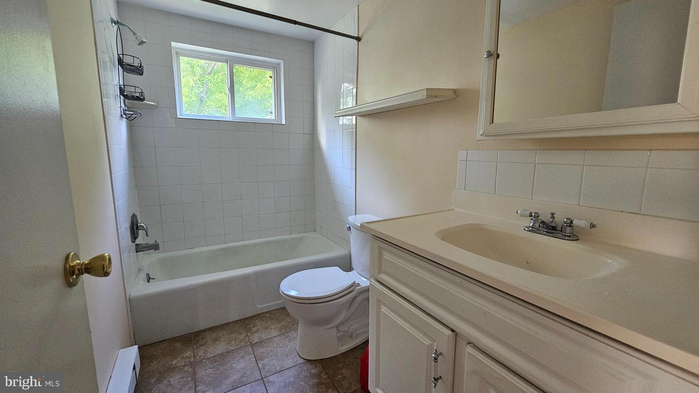 485 4th Avenue Warminster, PA 18974 - Photo 24 of 29 a bathroom with a granite countertop toilet sink and bathtub