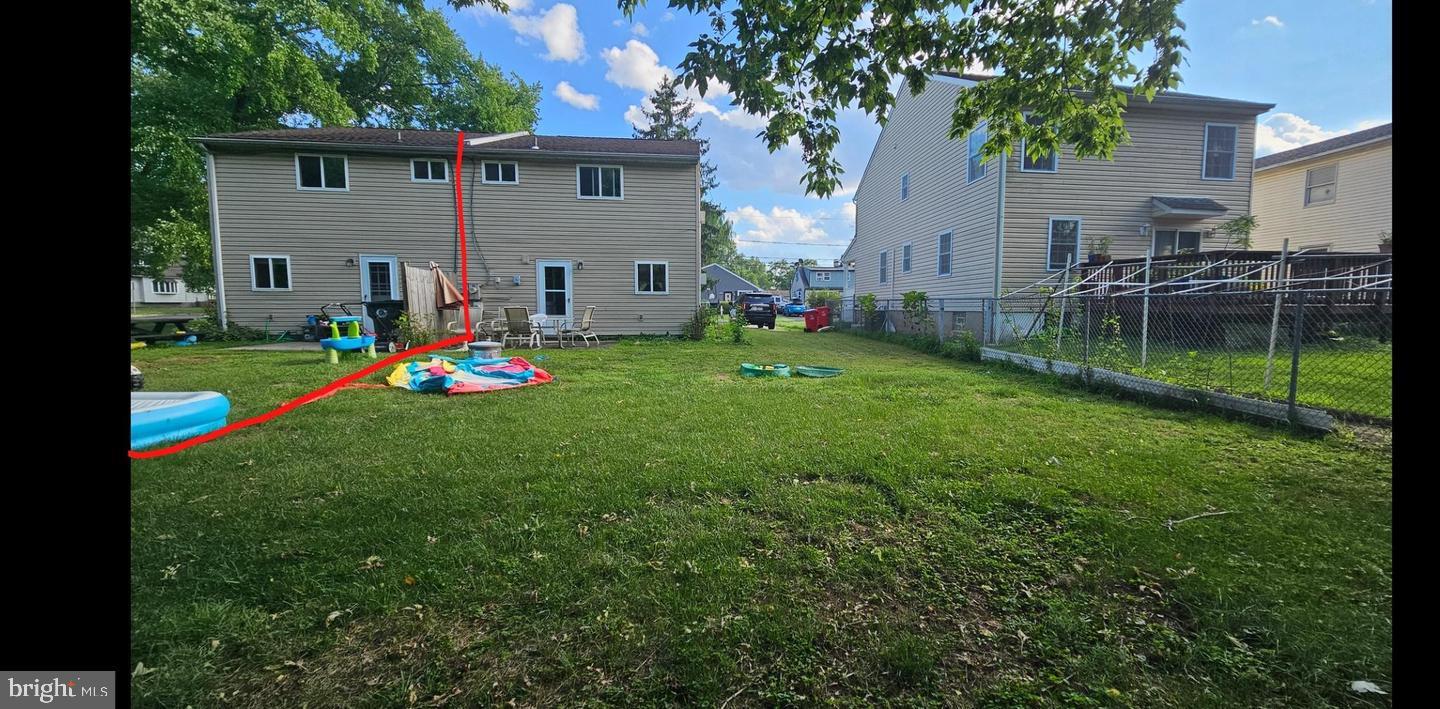 485 4th Avenue Warminster, PA 18974 - Photo 7 of 29 a view of a backyard with a table and chairs and potted plants