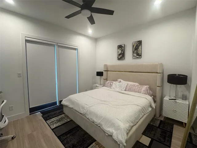 a bedroom with a bed and a walk in closet