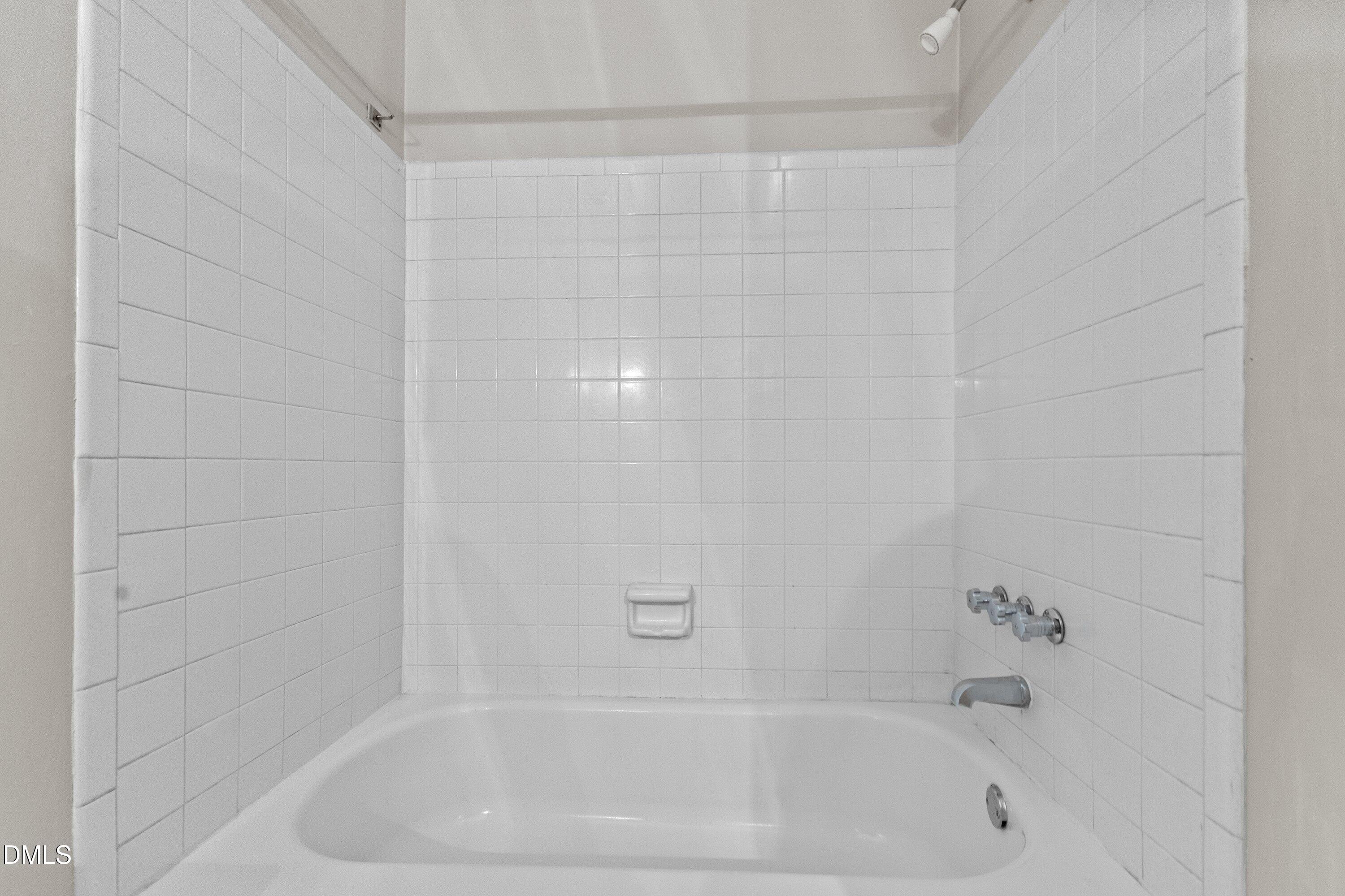 3605 Brentwood Road Raleigh, NC 27604 - Photo 23 of 42 a bathroom with a bathtub