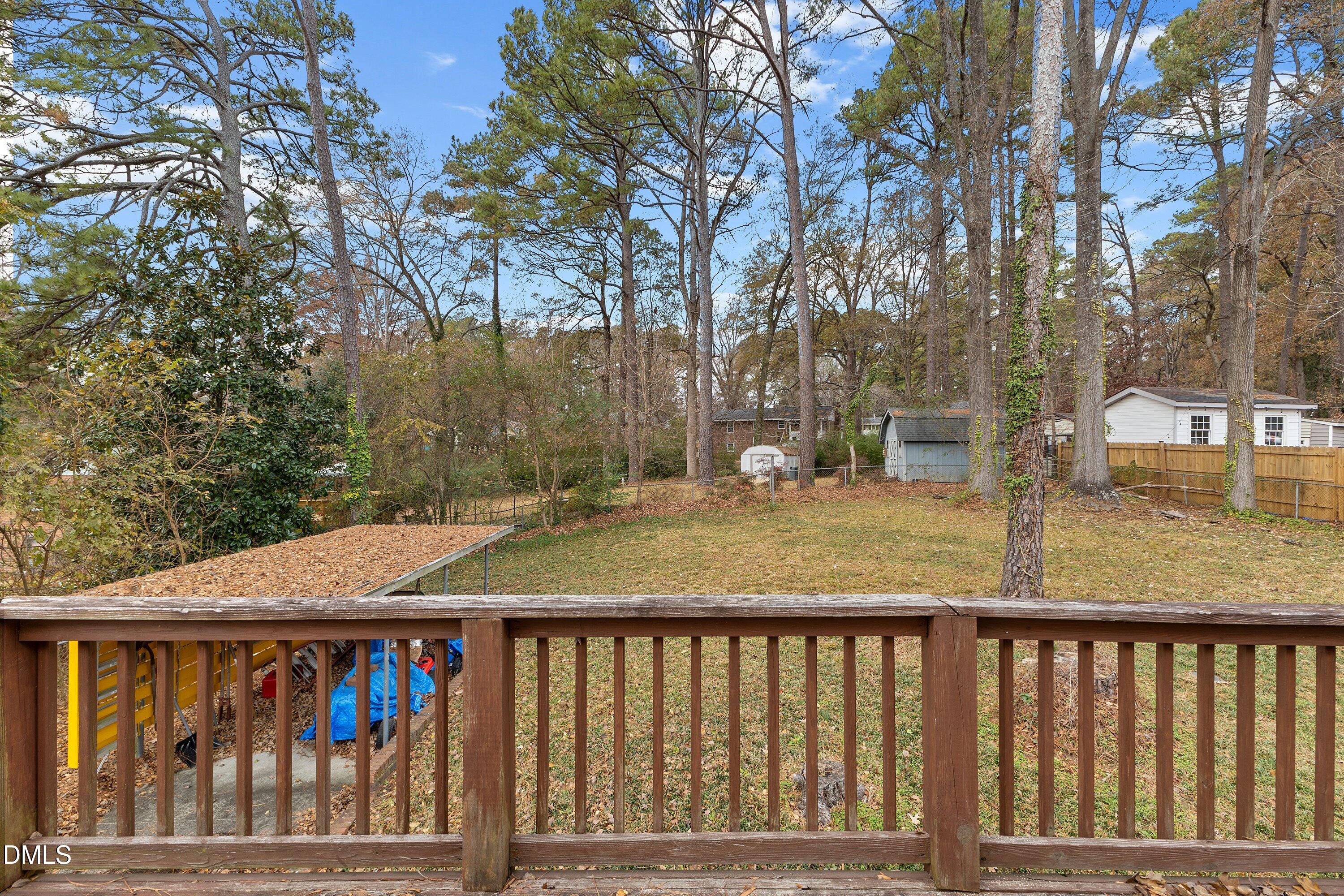 3605 Brentwood Road Raleigh, NC 27604 - Photo 36 of 42 a view of a wooden deck next to a yard