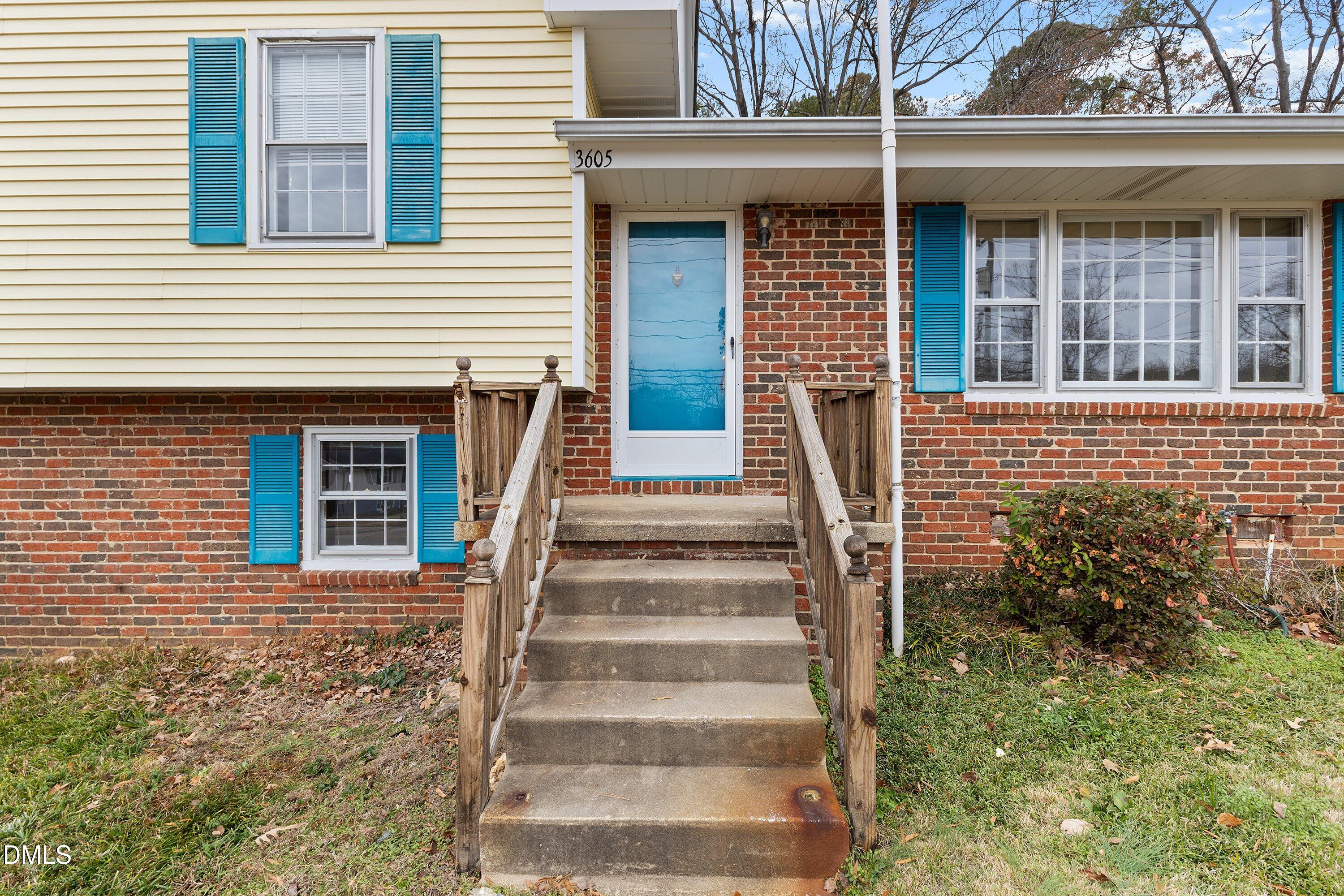 3605 Brentwood Road Raleigh, NC 27604 - Photo 5 of 42 a view of a house with more windows and brick walls