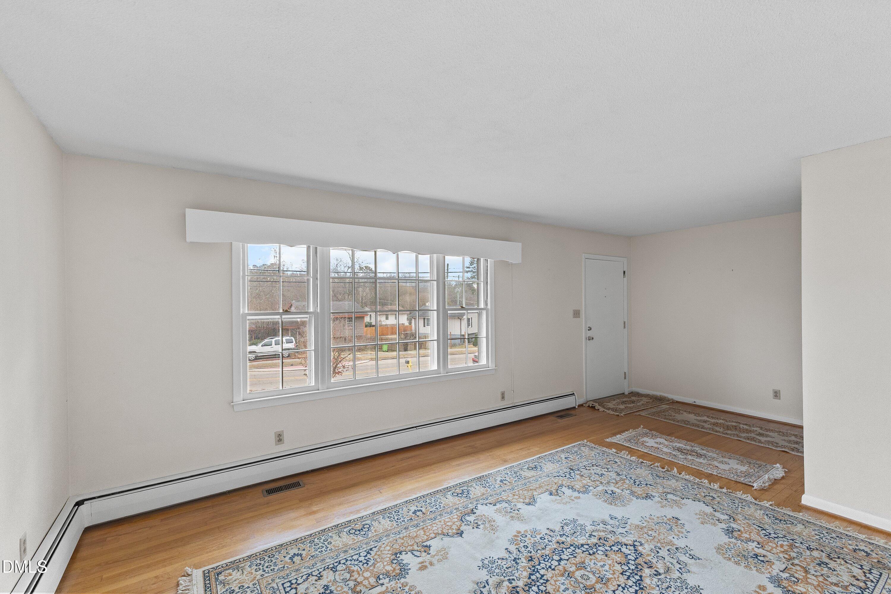 3605 Brentwood Road Raleigh, NC 27604 - Photo 9 of 42 a view of an empty room with a window