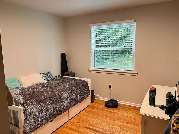 a bedroom with a bed and window