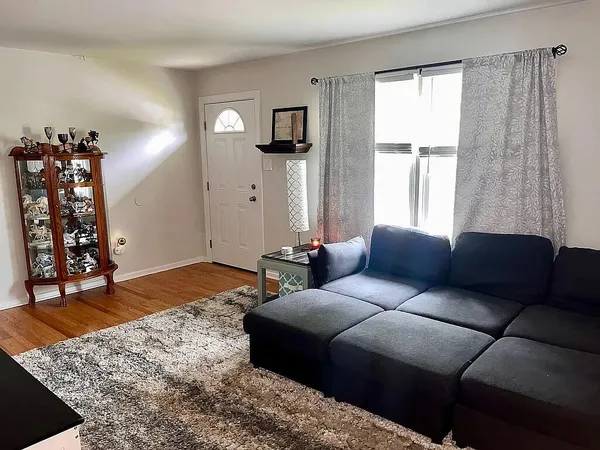a bedroom with a bed and a couch