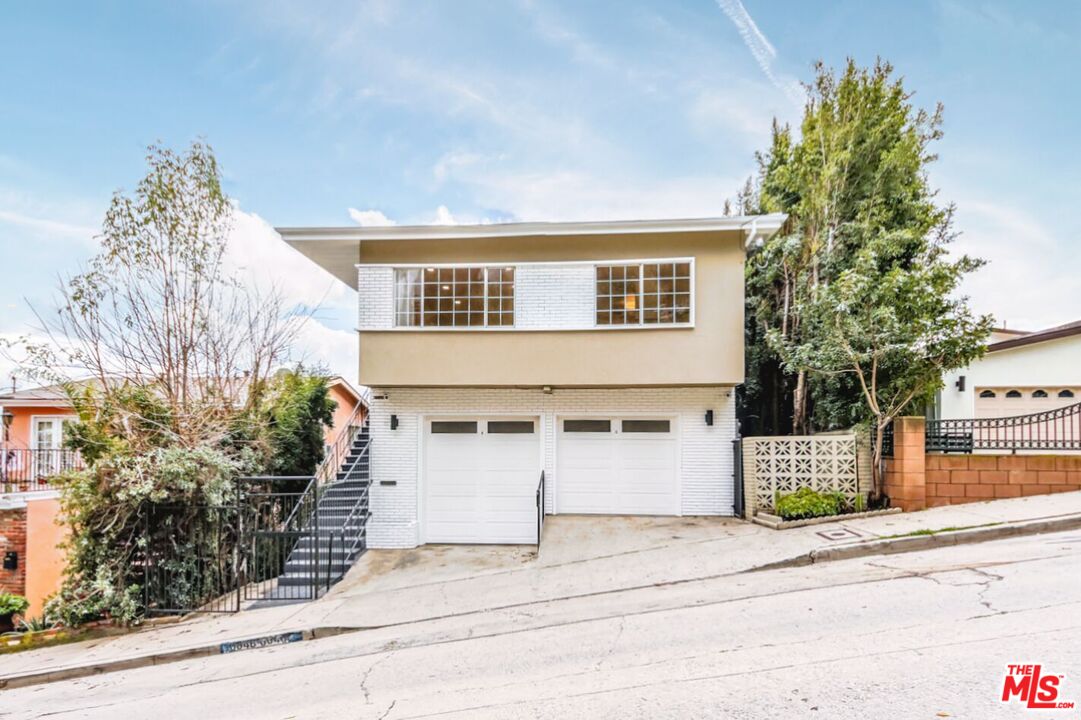 front view of a house with a street