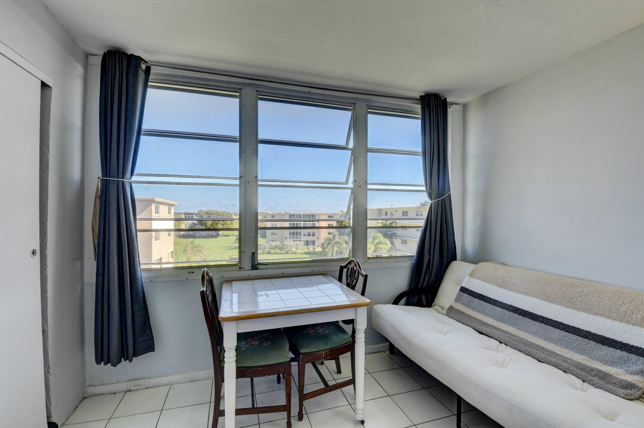 2620 Northeast 1st Court, Unit 403 Boynton Beach, FL 33435 - Photo 11 of 42 a reading room with furniture and a window