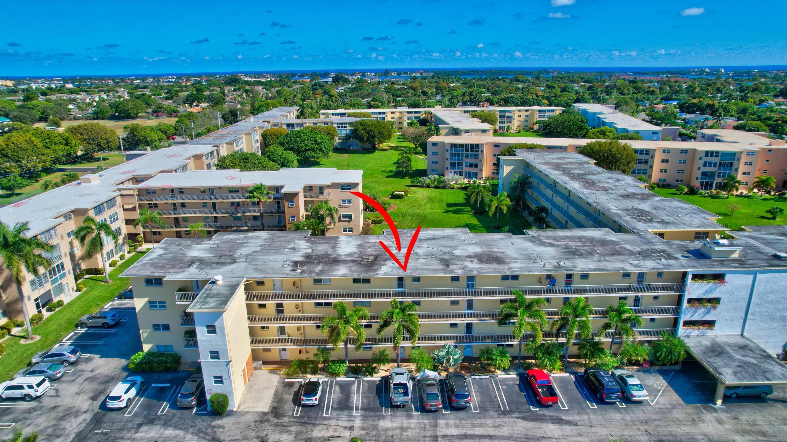 2620 Northeast 1st Court, Unit 403 Boynton Beach, FL 33435 - Photo 31 of 42 a view of a city with flower plants