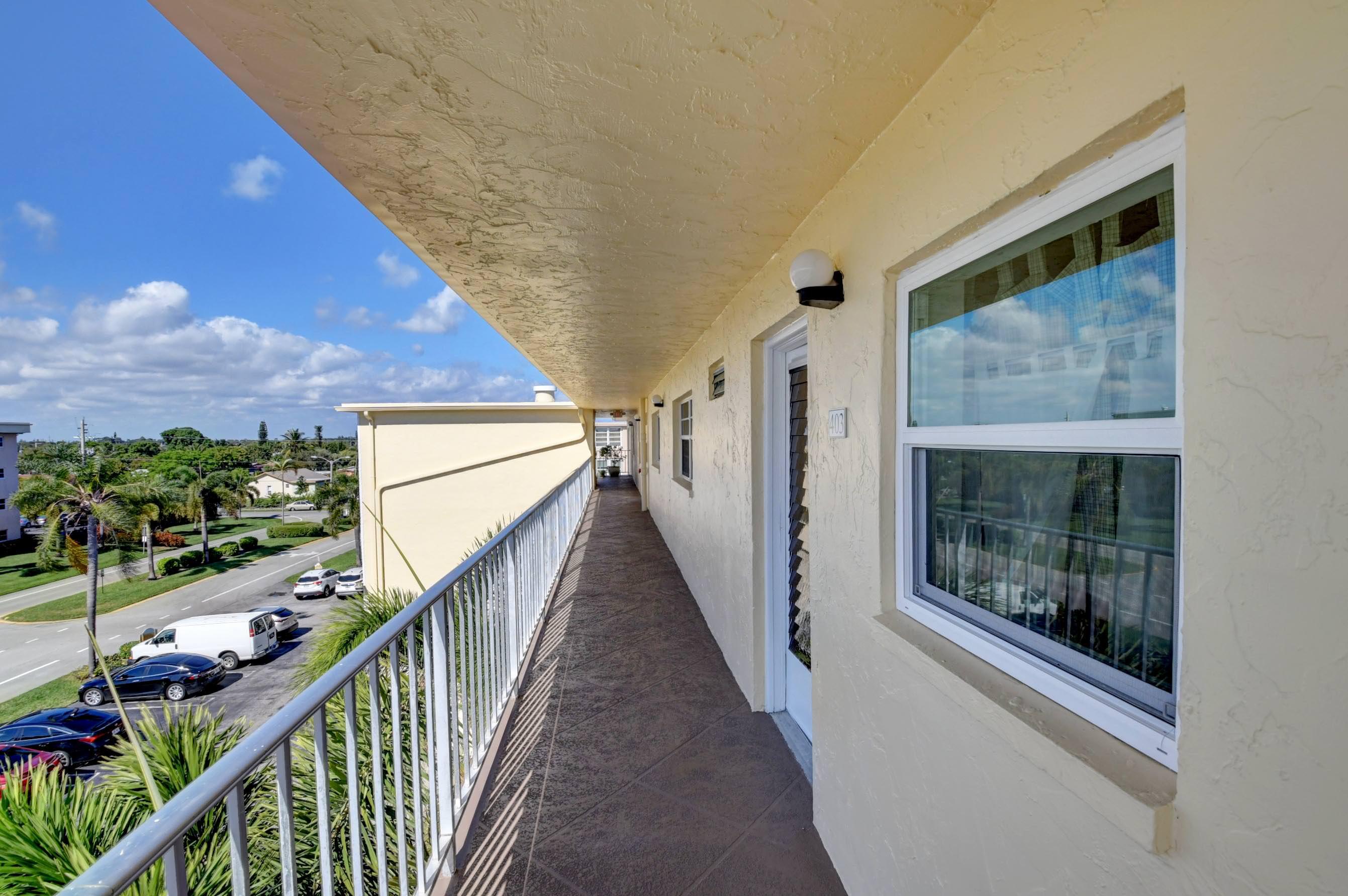 2620 Northeast 1st Court, Unit 403 Boynton Beach, FL 33435 - Photo 42 of 42 a view of balcony with wooden floor