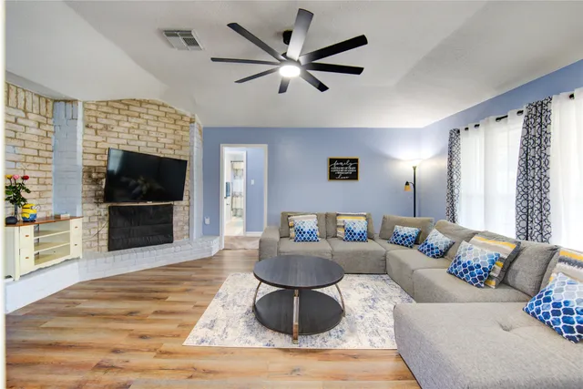 a living room with furniture and a flat screen tv