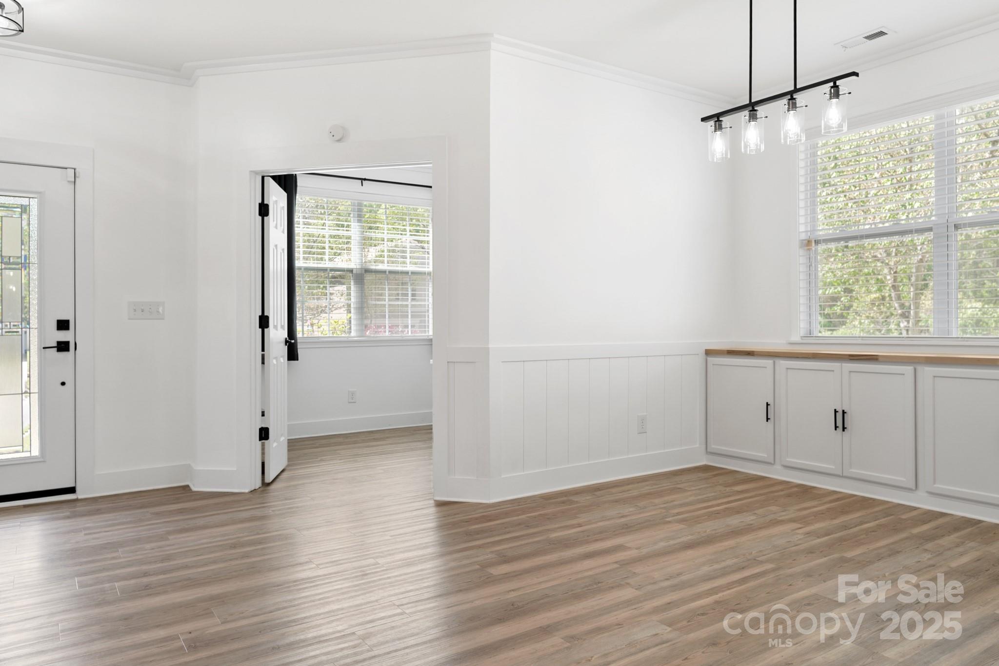 320 Allspice Road Fort Mill, SC 29708 - Photo 11 of 33 an empty room with wooden floor and windows
