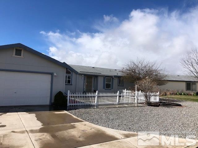 3975 Grouse Way Reno, NV 89508 - Photo 1 of 18 a view of a house with a yard and garage