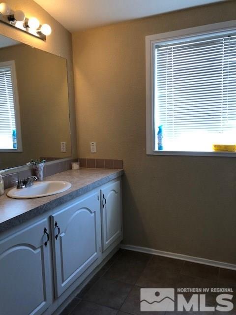 3975 Grouse Way Reno, NV 89508 - Photo 11 of 18 a room with a sink cabinets and a window