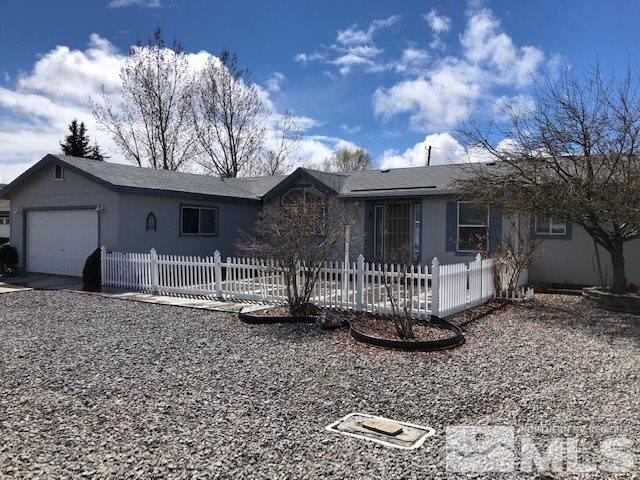 3975 Grouse Way Reno, NV 89508 - Photo 2 of 18 a front view of a house with a garden