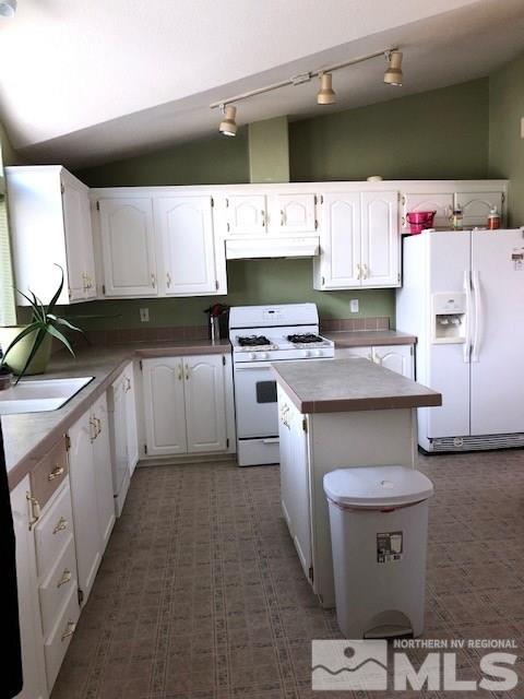 3975 Grouse Way Reno, NV 89508 - Photo 3 of 18 a kitchen with a sink stove and cabinets