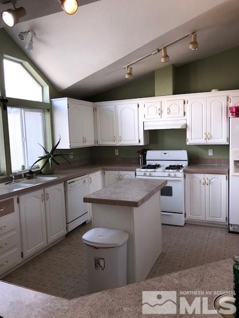 3975 Grouse Way Reno, NV 89508 - Photo 4 of 18 a kitchen with granite countertop a sink a counter top space appliances and cabinets