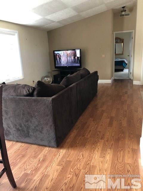 3975 Grouse Way Reno, NV 89508 - Photo 6 of 18 a living room with furniture and a flat screen tv