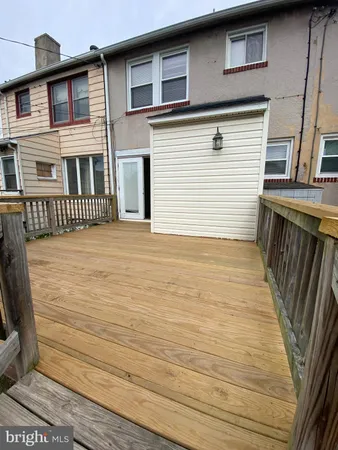 a view of a house with wooden stairs