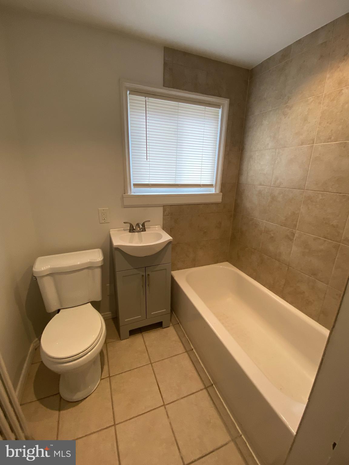 30 Portship Road Baltimore, MD 21222 - Photo 8 of 16 a white toilet sitting next to a bath tub