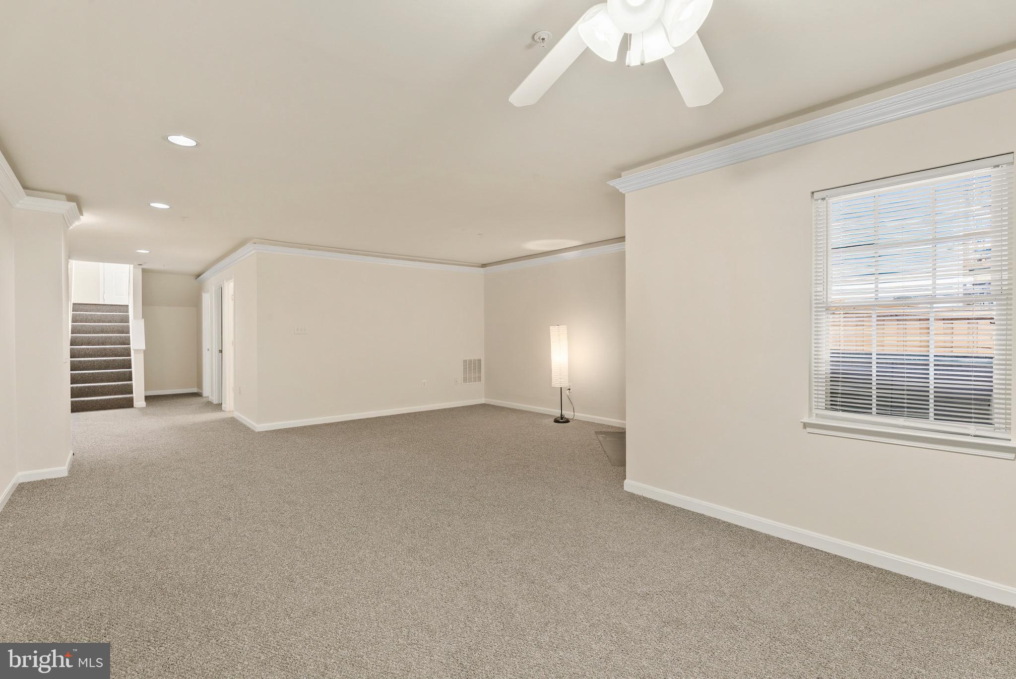 1709 Woodruff Way Frederick, MD 21701 - Photo 22 of 42 a view of a livingroom with a staircase