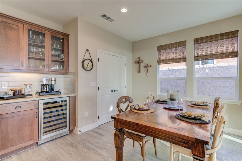 1582 Eucalyptus Road Nipomo, CA 93444 - Photo 23 of 62 a view of a dining room with furniture window and wooden floor