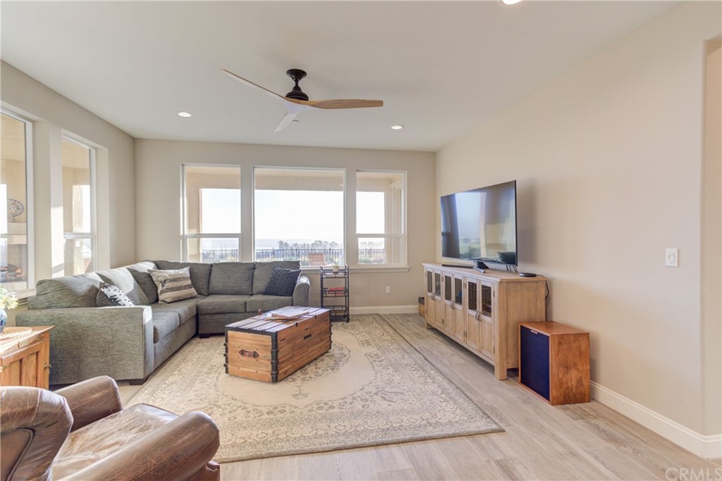 1582 Eucalyptus Road Nipomo, CA 93444 - Photo 27 of 62 a living room with furniture and a flat screen tv