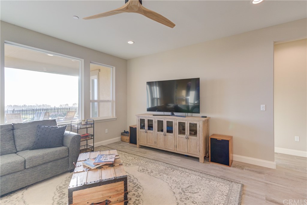 1582 Eucalyptus Road Nipomo, CA 93444 - Photo 29 of 62 a living room with furniture and a flat screen tv