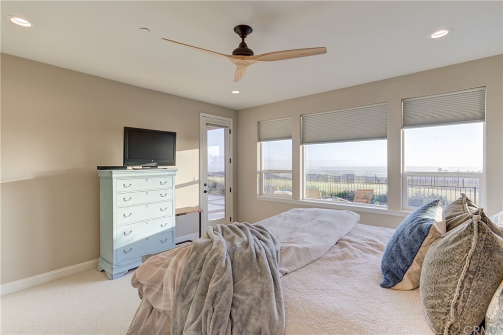 1582 Eucalyptus Road Nipomo, CA 93444 - Photo 37 of 62 a bedroom with a bed and a flat tv screen on dresser