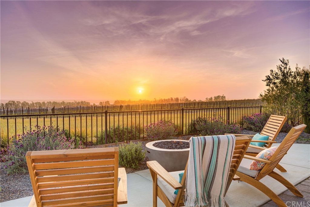 1582 Eucalyptus Road Nipomo, CA 93444 - Photo 4 of 62 a view of a chairs and table on wooden deck with lake view