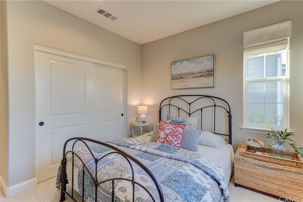 1582 Eucalyptus Road Nipomo, CA 93444 - Photo 10 of 62 a bedroom with a bed and a chair