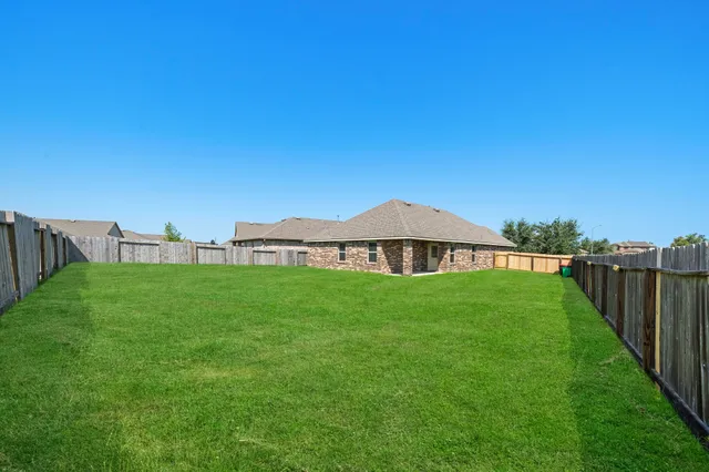a view of a back yard of the house