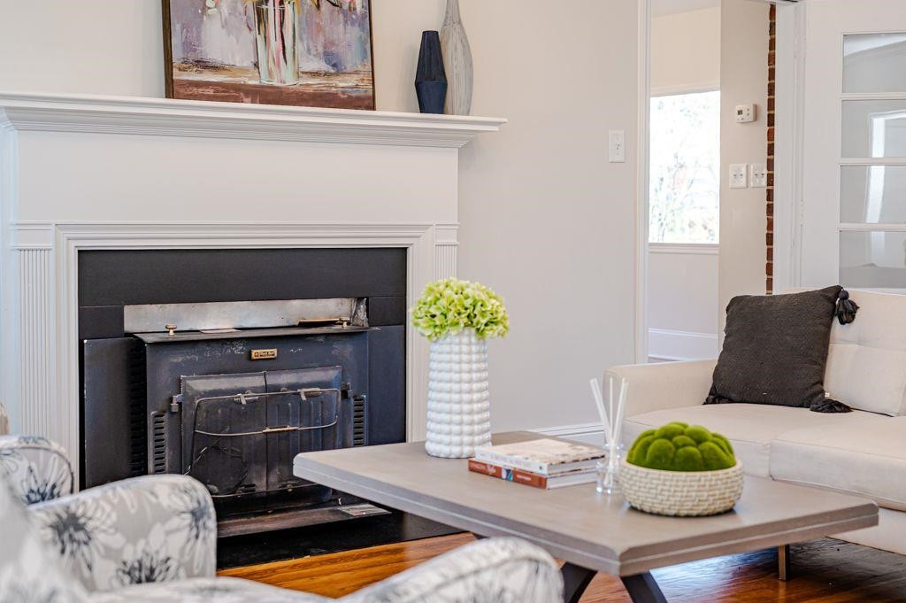 2618 Wade Avenue Raleigh, NC 27607 - Photo 12 of 62 a living room with furniture and a fireplace