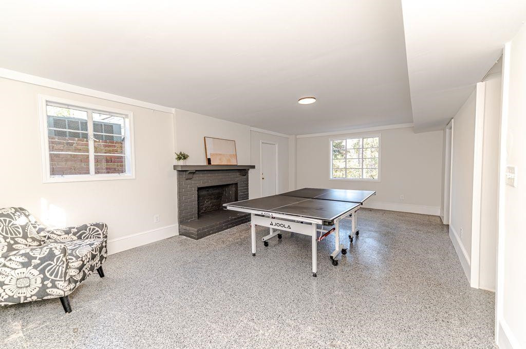 2618 Wade Avenue Raleigh, NC 27607 - Photo 13 of 62 a living room with furniture a fireplace and a window