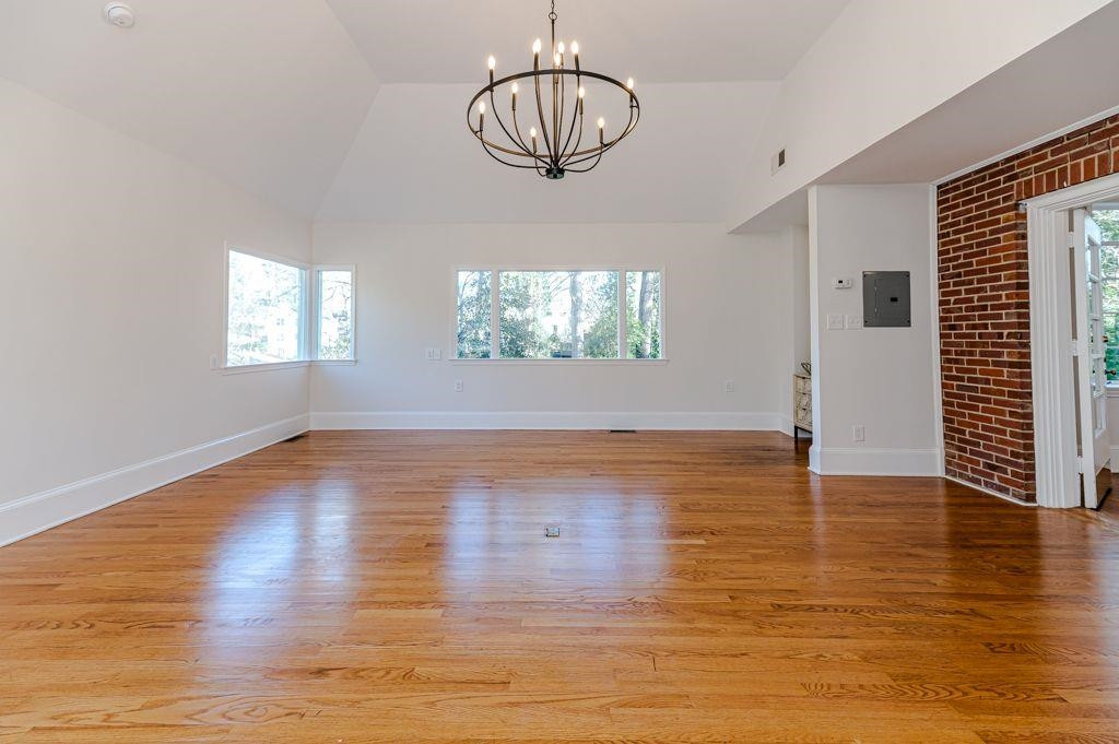 2618 Wade Avenue Raleigh, NC 27607 - Photo 14 of 62 a view of empty room with wooden floor and window