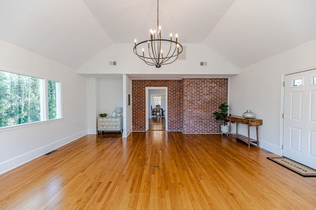 2618 Wade Avenue Raleigh, NC 27607 - Photo 15 of 62 a view of empty room with wooden floor and fan