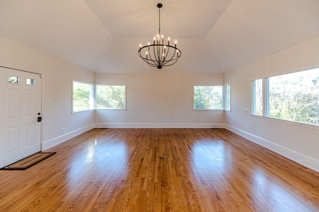 2618 Wade Avenue Raleigh, NC 27607 - Photo 17 of 62 a view of an empty room with wooden floor and a window