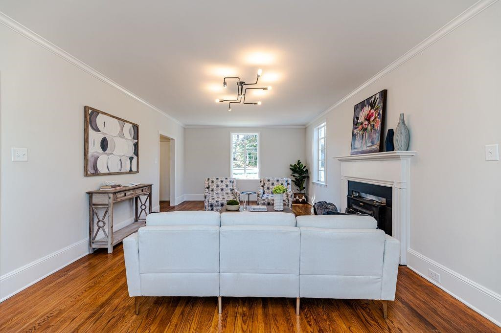 2618 Wade Avenue Raleigh, NC 27607 - Photo 21 of 62 a living room with furniture and a fireplace